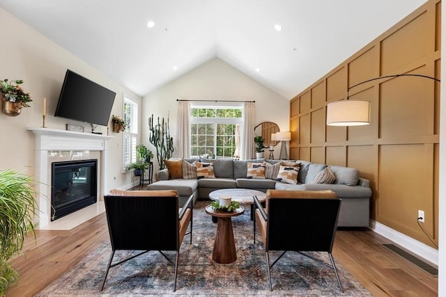 109 Phoebe St Unit 109, Methuen, MA 01844 - living area featuring wood finished floors, a high end fireplace, and high vaulted ceiling