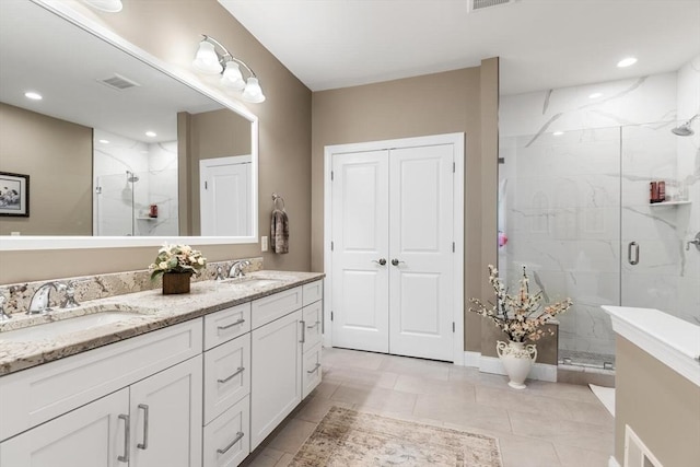 109 Phoebe St Unit 109, Methuen, MA 01844 - bathroom featuring a marble finish shower, double vanity, tile patterned flooring, and recessed lighting