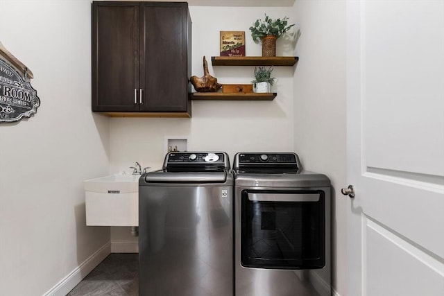 109 Phoebe St Unit 109, Methuen, MA 01844 - washroom featuring separate washer and dryer, cabinet space, and tile patterned flooring
