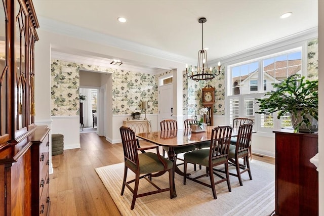 109 Phoebe St Unit 109, Methuen, MA 01844 - dining area featuring ornamental molding, wainscoting, wallpapered walls, light wood finished floors, and a chandelier