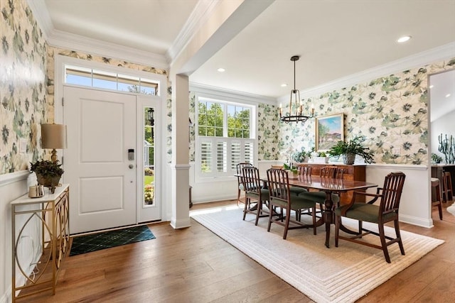 109 Phoebe St Unit 109, Methuen, MA 01844 - entryway featuring wallpapered walls, a wainscoted wall, plenty of natural light, wood-type flooring, and a chandelier