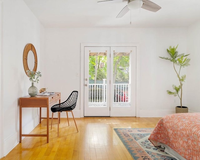 doorway to outside with light wood-style flooring, ceiling fan, and baseboards
