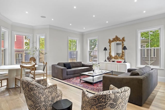 living room with plenty of natural light, recessed lighting, crown molding, and baseboards