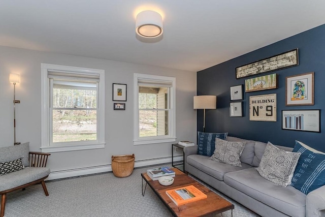 living area featuring baseboards, carpet flooring, and baseboard heating
