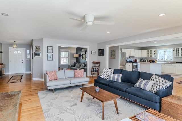 living area with ceiling fan, recessed lighting, and light wood-style flooring