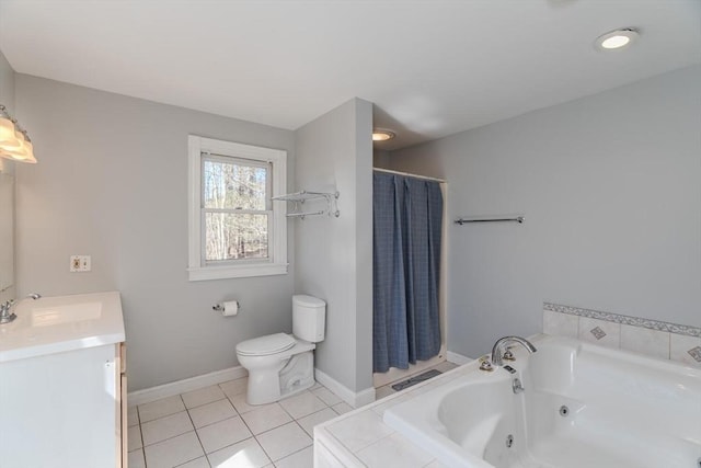 full bath with vanity, toilet, tile patterned floors, a jetted tub, and baseboards