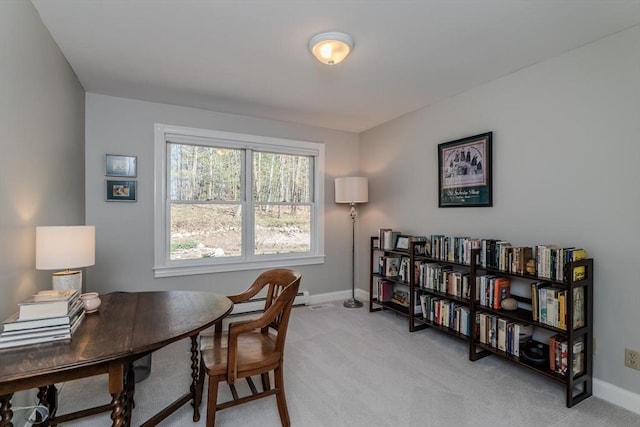 office area with baseboards and light carpet