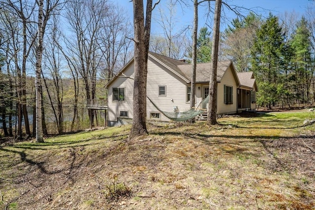 view of property exterior with a yard