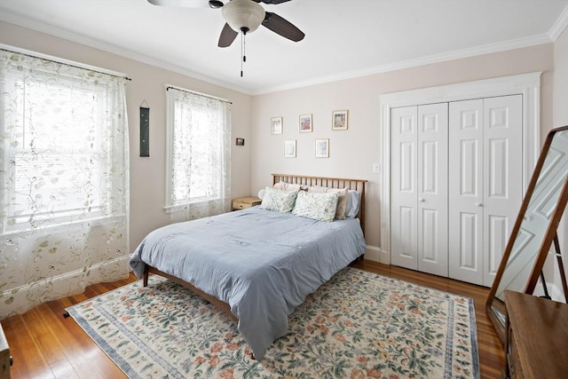 17 Eliot St Unit 17, Medford, MA 02155 - bedroom with wood finished floors, crown molding, a closet, and ceiling fan