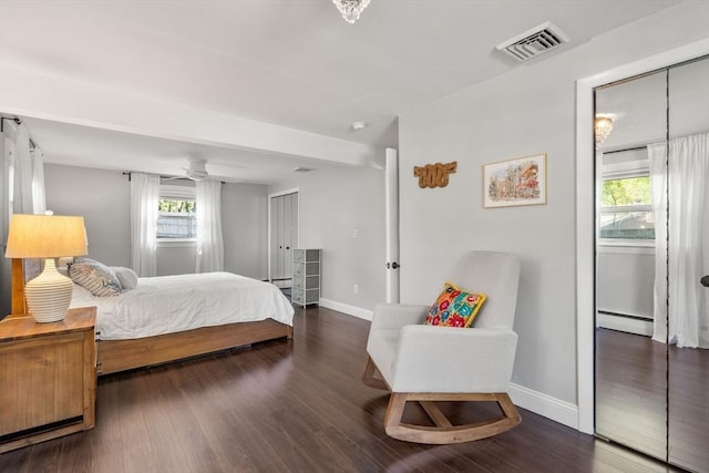 5 Eclipse Ave, Chelmsford, MA 01824 - bedroom featuring a baseboard radiator, wood finished floors, and multiple windows