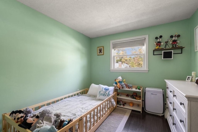 5 Eclipse Ave, Chelmsford, MA 01824 - bedroom featuring a textured ceiling and dark wood-type flooring