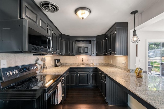 5 Eclipse Ave, Chelmsford, MA 01824 - kitchen featuring black range with electric cooktop, stainless steel microwave, a sink, dark wood finished floors, and backsplash