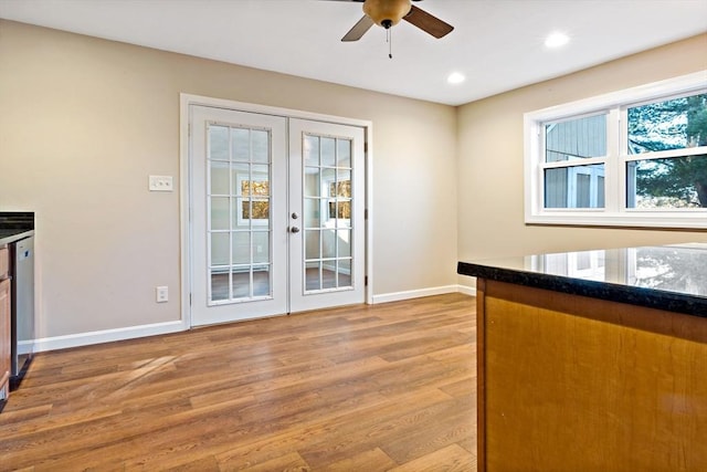 kitchen with ceiling fan, dishwasher, light wood-type flooring, and french doors