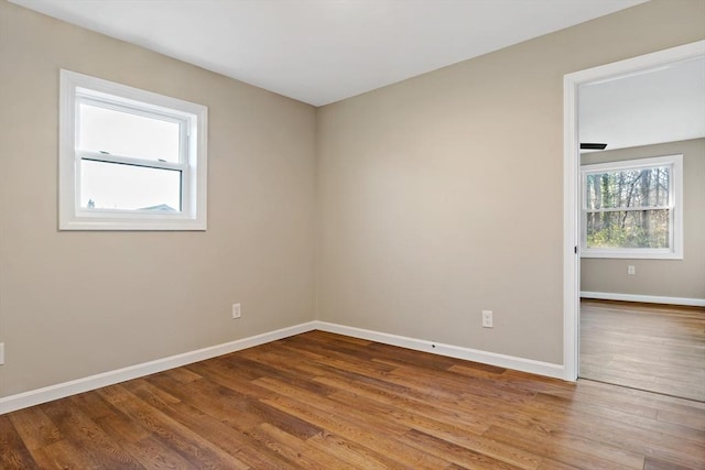 spare room featuring hardwood / wood-style flooring