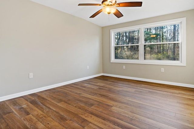 spare room with ceiling fan and wood-type flooring