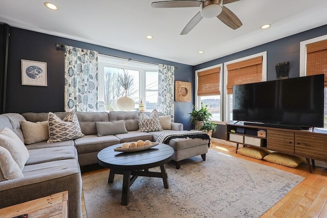 living room with wood finished floors, ceiling fan, and recessed lighting