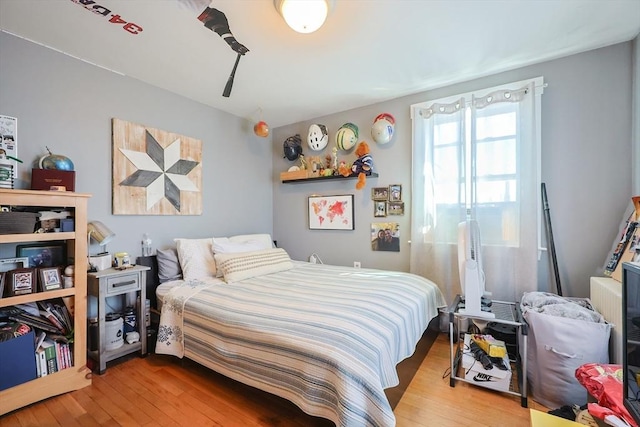 bedroom with wood finished floors