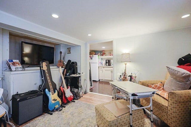living area featuring recessed lighting and wood finished floors