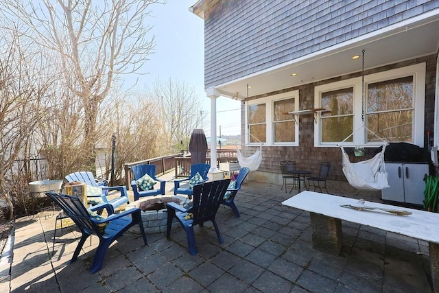 view of patio / terrace with a fire pit