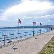 property view of water with a pier