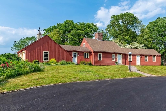 57 Rudon Dr, North Attleboro, MA 02760 - view of front of home with a chimney and a front lawn