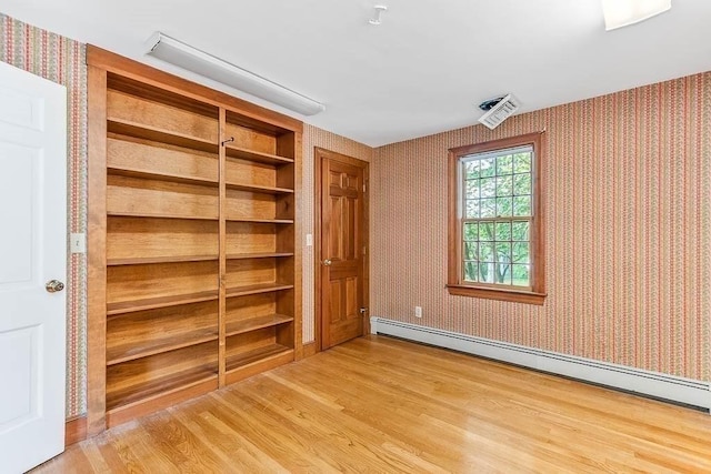 57 Rudon Dr, North Attleboro, MA 02760 - unfurnished bedroom featuring a baseboard heating unit, wallpapered walls, light wood finished floors, and a closet