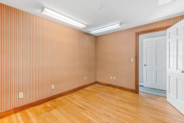 57 Rudon Dr, North Attleboro, MA 02760 - spare room featuring light wood-style flooring, wallpapered walls, and baseboard heating
