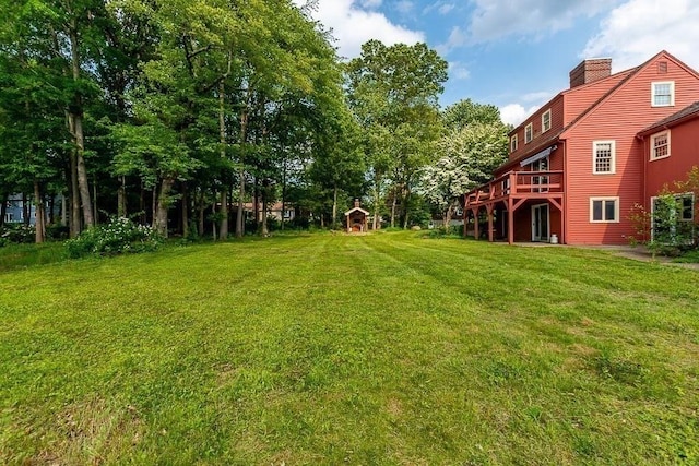 57 Rudon Dr, North Attleboro, MA 02760 - view of grassy yard featuring a deck