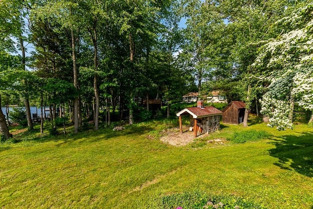 57 Rudon Dr, North Attleboro, MA 02760 - view of grassy yard featuring an outbuilding