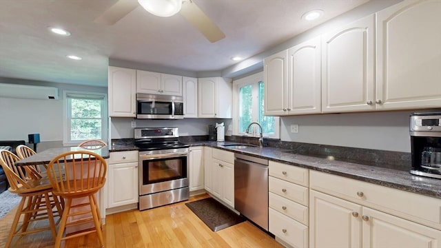 1000 Forest St, North Andover, MA 01845 - kitchen with appliances with stainless steel finishes, a sink, healthy amount of natural light, light wood-style floors, and recessed lighting