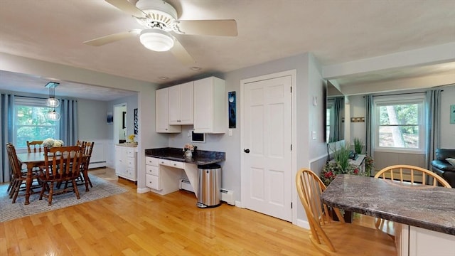 1000 Forest St, North Andover, MA 01845 - kitchen with white cabinets, light wood-style flooring, and dark countertops