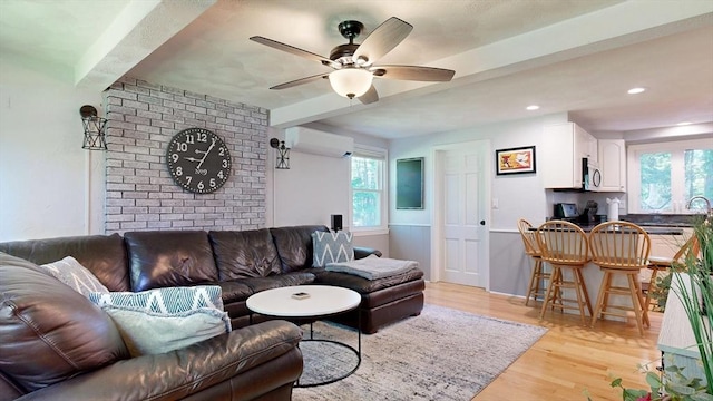 1000 Forest St, North Andover, MA 01845 - living area featuring beam ceiling, ceiling fan, light wood-style flooring, a wall mounted AC, and recessed lighting