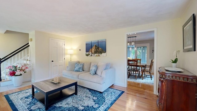 1000 Forest St, North Andover, MA 01845 - living area with light wood-style floors, stairway, and baseboards