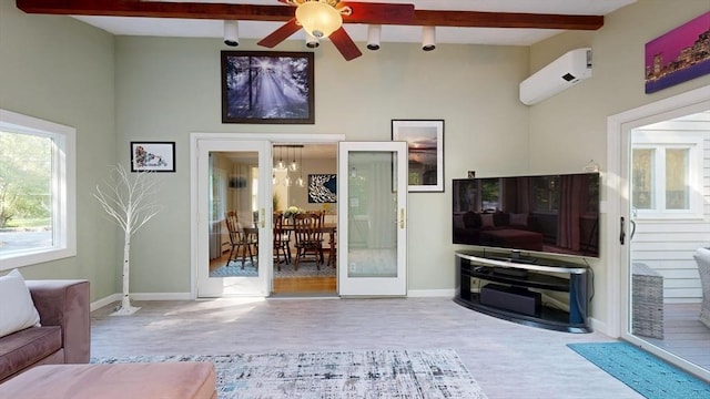 1000 Forest St, North Andover, MA 01845 - living area featuring a wall mounted air conditioner, beam ceiling, wood finished floors, a ceiling fan, and baseboards