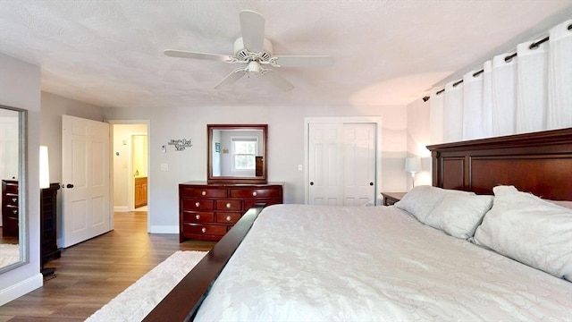 1000 Forest St, North Andover, MA 01845 - bedroom with wood finished floors, a closet, baseboards, and ceiling fan