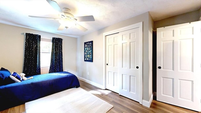 1000 Forest St, North Andover, MA 01845 - bedroom featuring baseboards, wood finished floors, a closet, and ceiling fan
