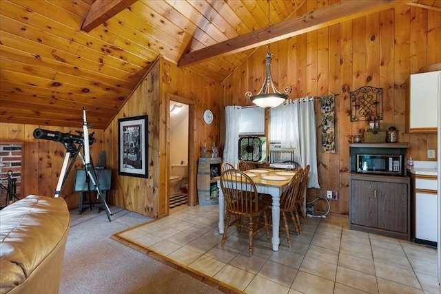 tiled dining area featuring wood walls, wooden ceiling, and vaulted ceiling with beams