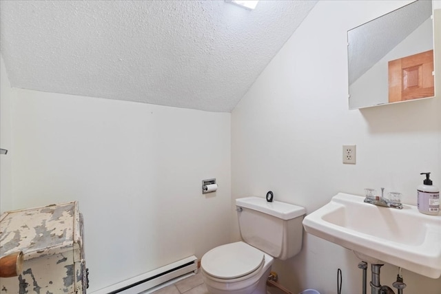 bathroom featuring a textured ceiling, vaulted ceiling, tile patterned flooring, toilet, and baseboard heating