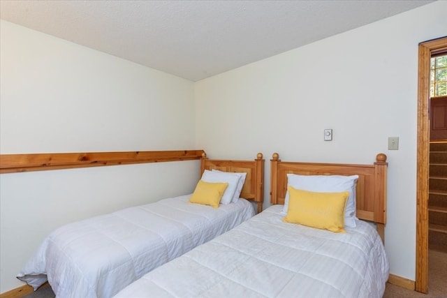 bedroom with light colored carpet