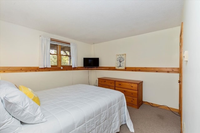 bedroom with light colored carpet