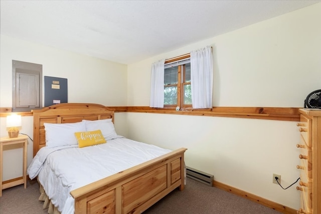 carpeted bedroom with a baseboard heating unit and electric panel