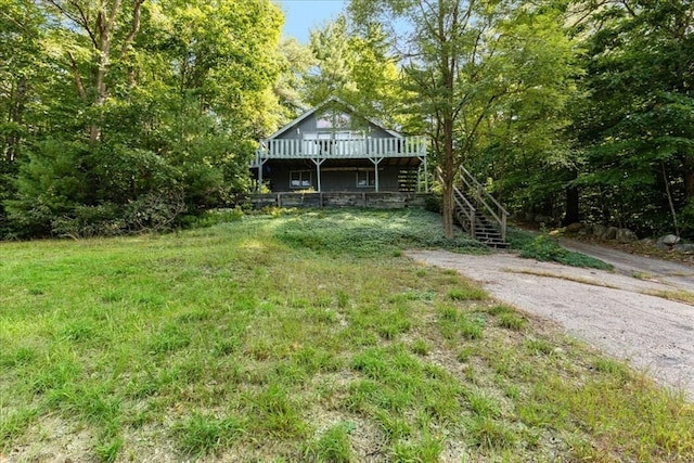 view of yard with a wooden deck