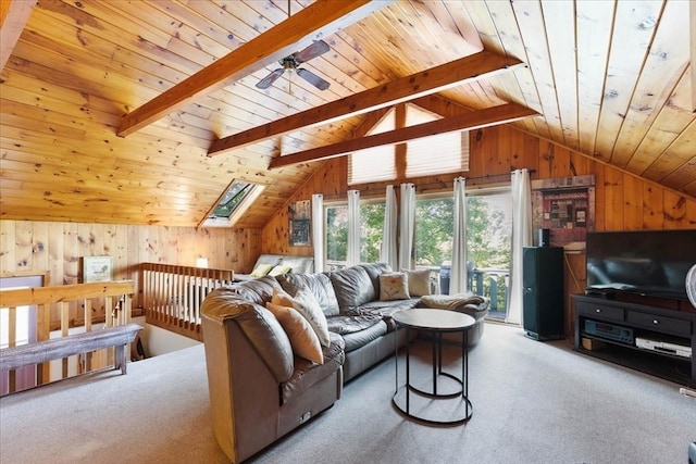 carpeted living room with wooden ceiling, wooden walls, ceiling fan, and vaulted ceiling with beams