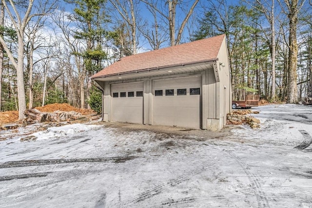 view of snow covered garage