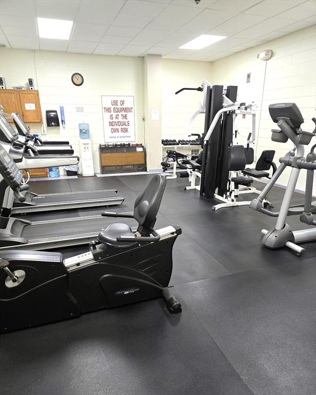 workout area featuring a drop ceiling