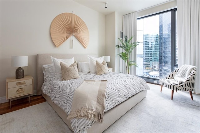 bedroom with hardwood / wood-style floors