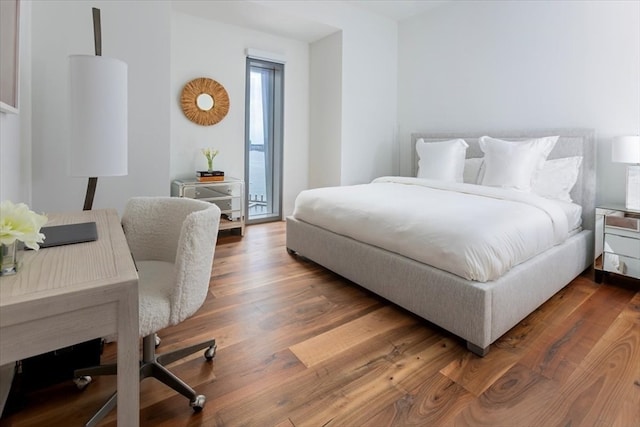 bedroom featuring dark wood-type flooring