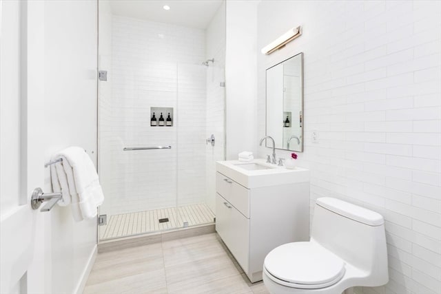 bathroom featuring tile patterned flooring, an enclosed shower, vanity, and toilet