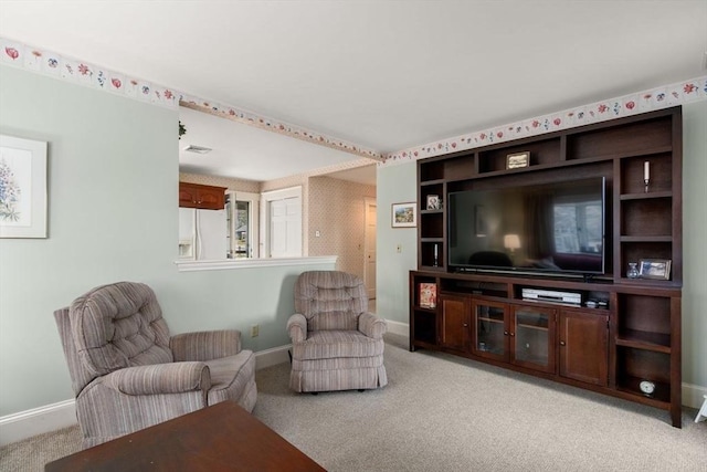 living room with baseboards and carpet flooring