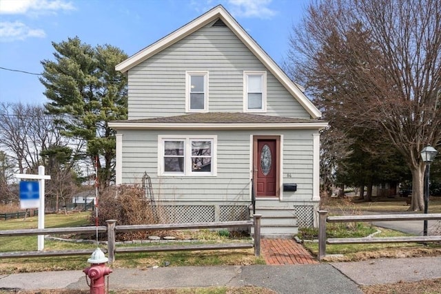 view of front of home featuring fence and entry steps